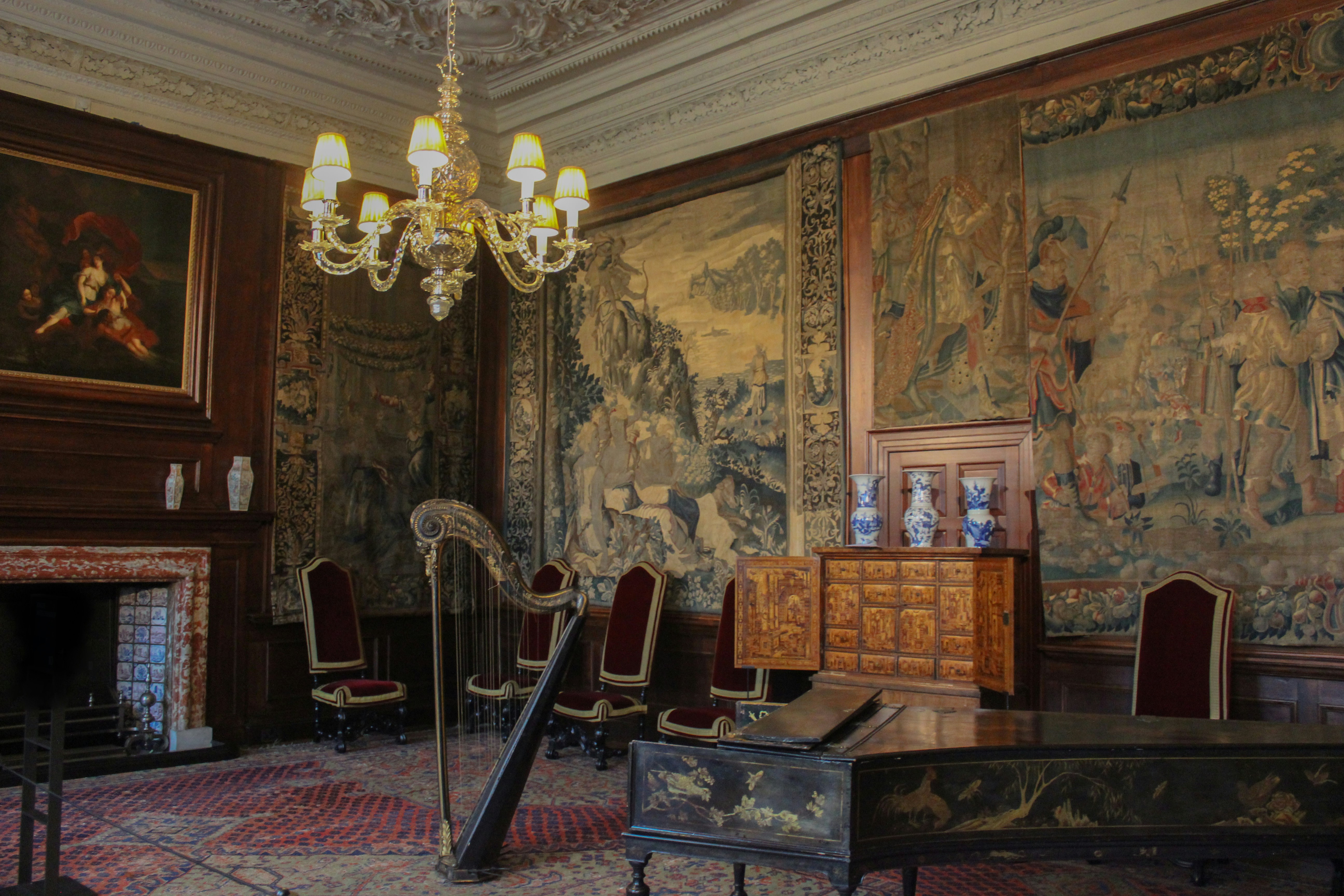 Historic interior with chandelier and framed paintings